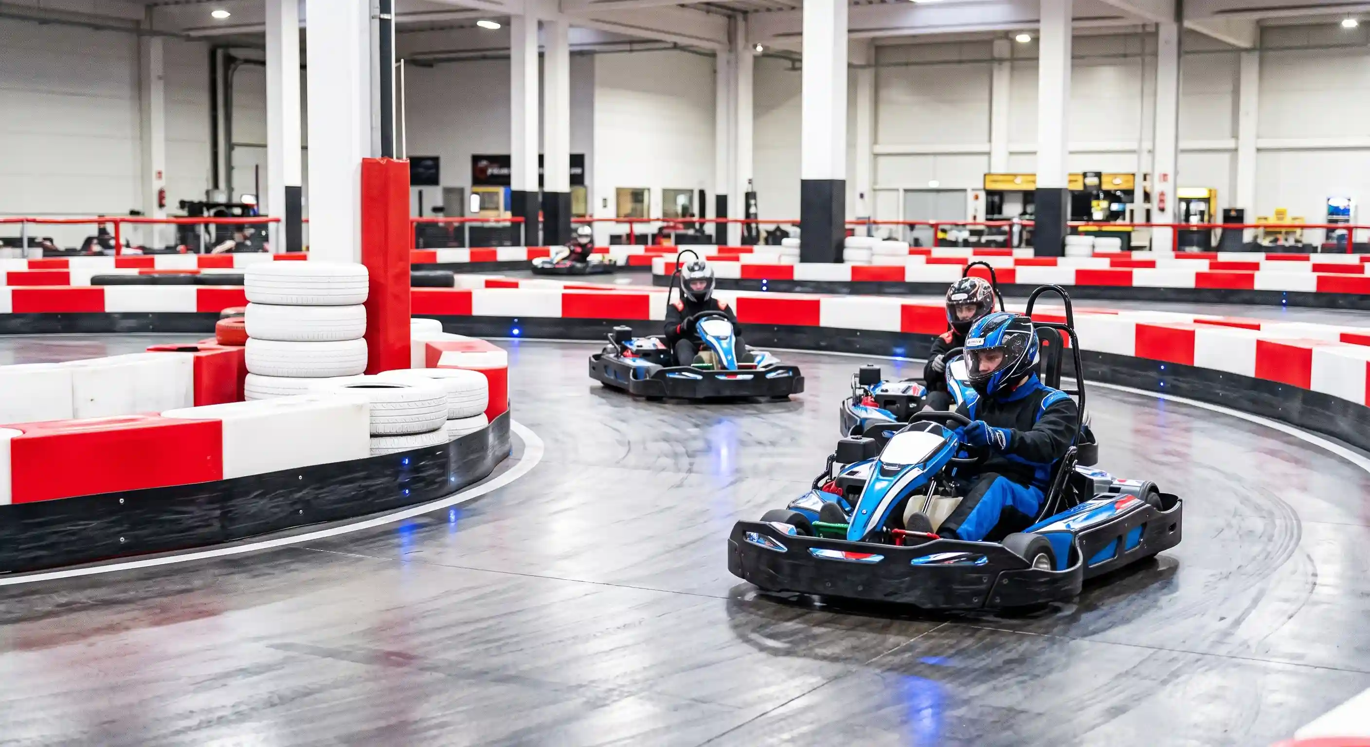 CYBER FIREBIRD indoor go-kart safety management system protecting drivers on a commercial racing track.